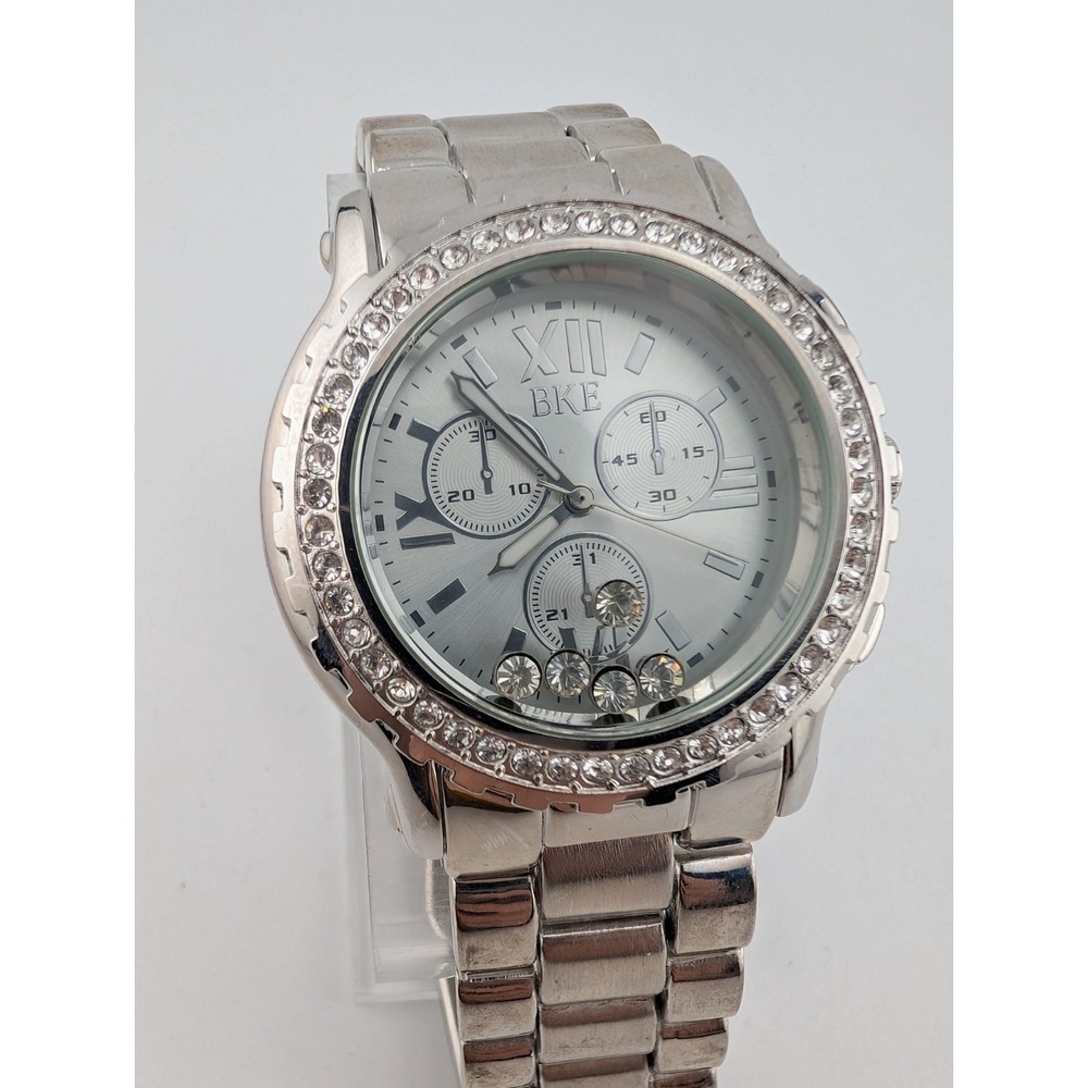 BKE Women's Watch 38mm Case Floating Crystals 6.75" Silver Band- New Battery